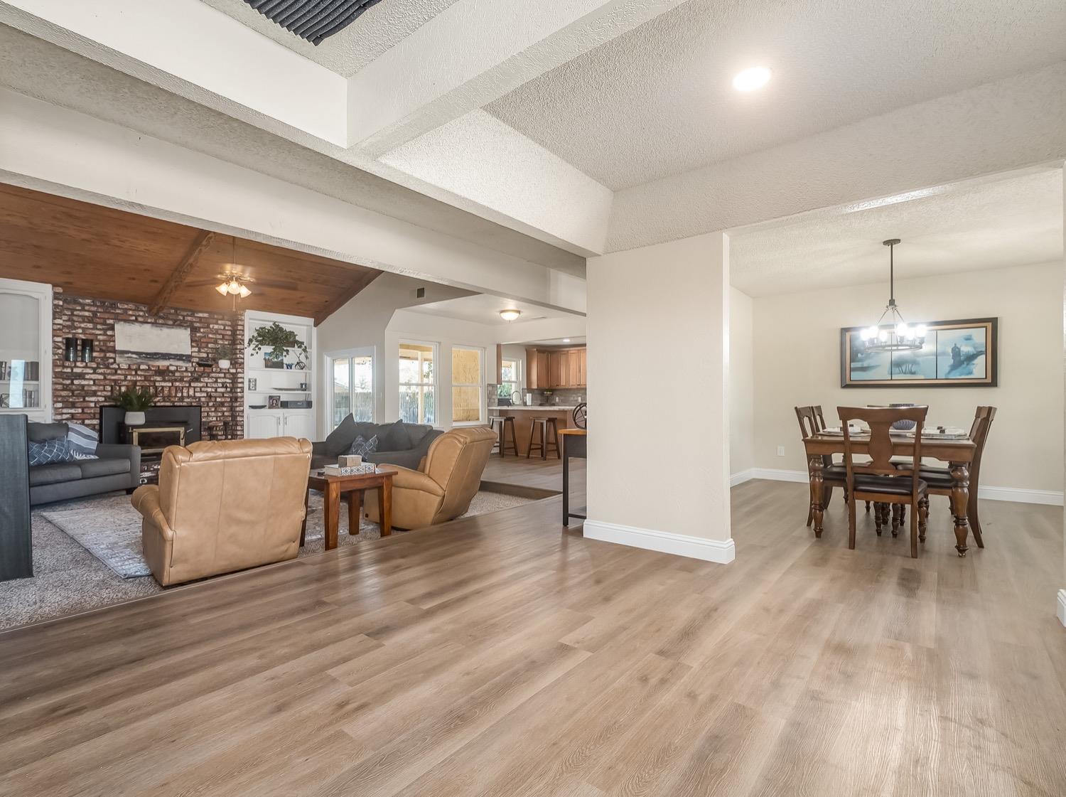 16181 Monreal Road Madera, CA 93636 - Photo 3 of 40 a dining room with furniture and wooden floor