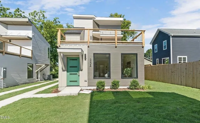 front view of a house with a yard