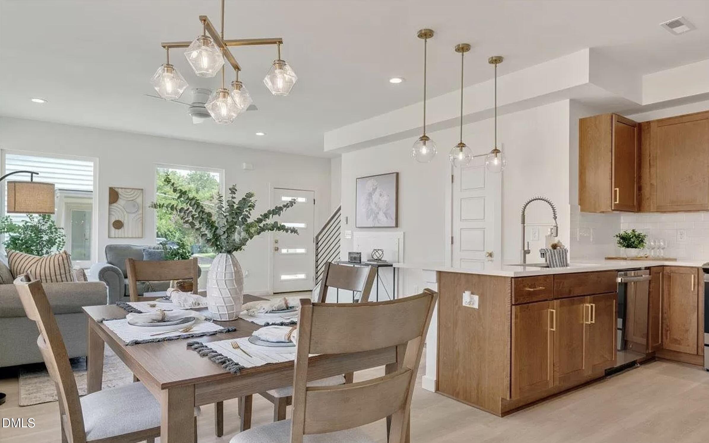 502 A Commonwealth Street Durham, NC 27703 - Photo 15 of 30 a dining room with furniture a chandelier and kitchen view