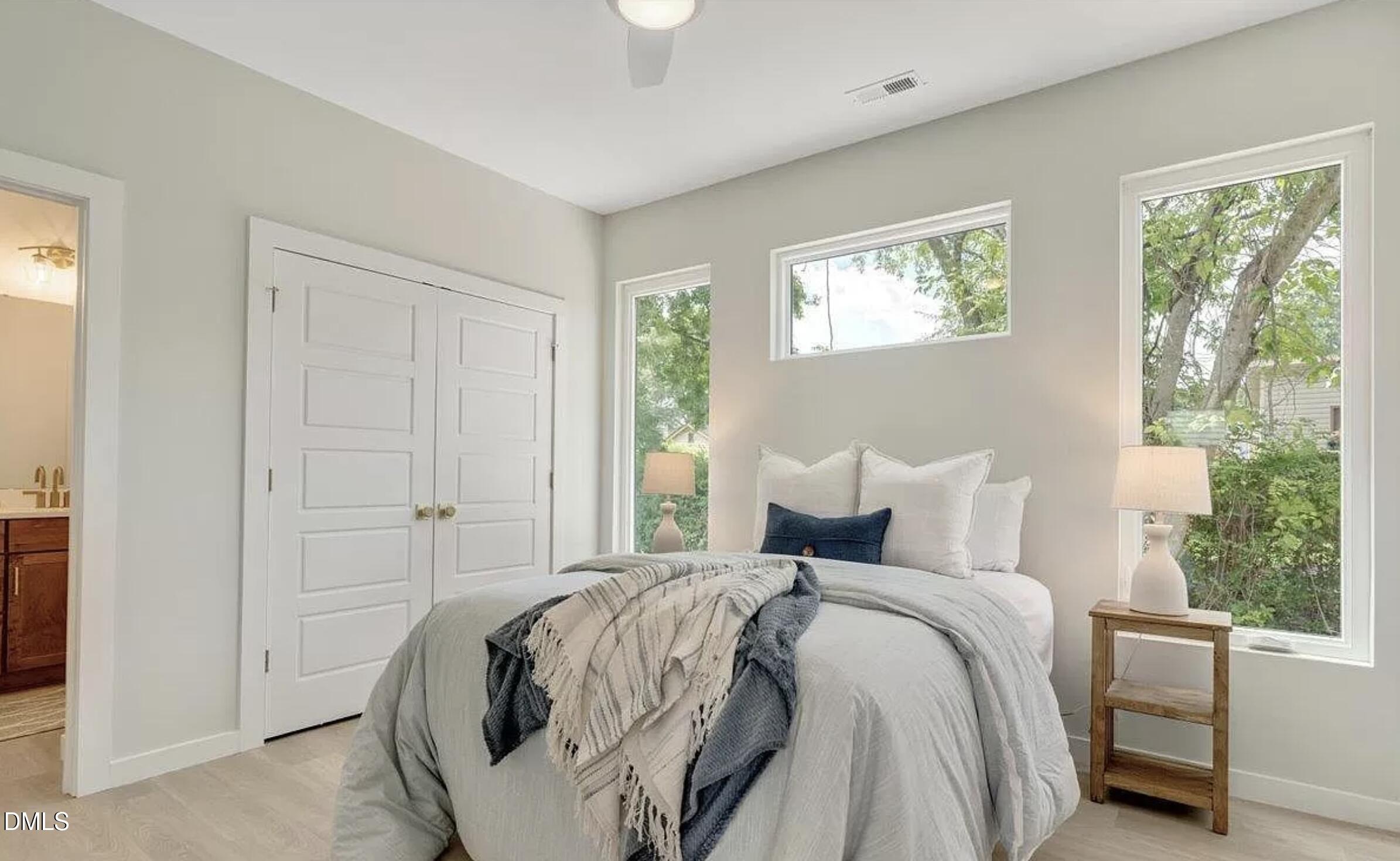 502 A Commonwealth Street Durham, NC 27703 - Photo 16 of 30 a bedroom with bed and a window