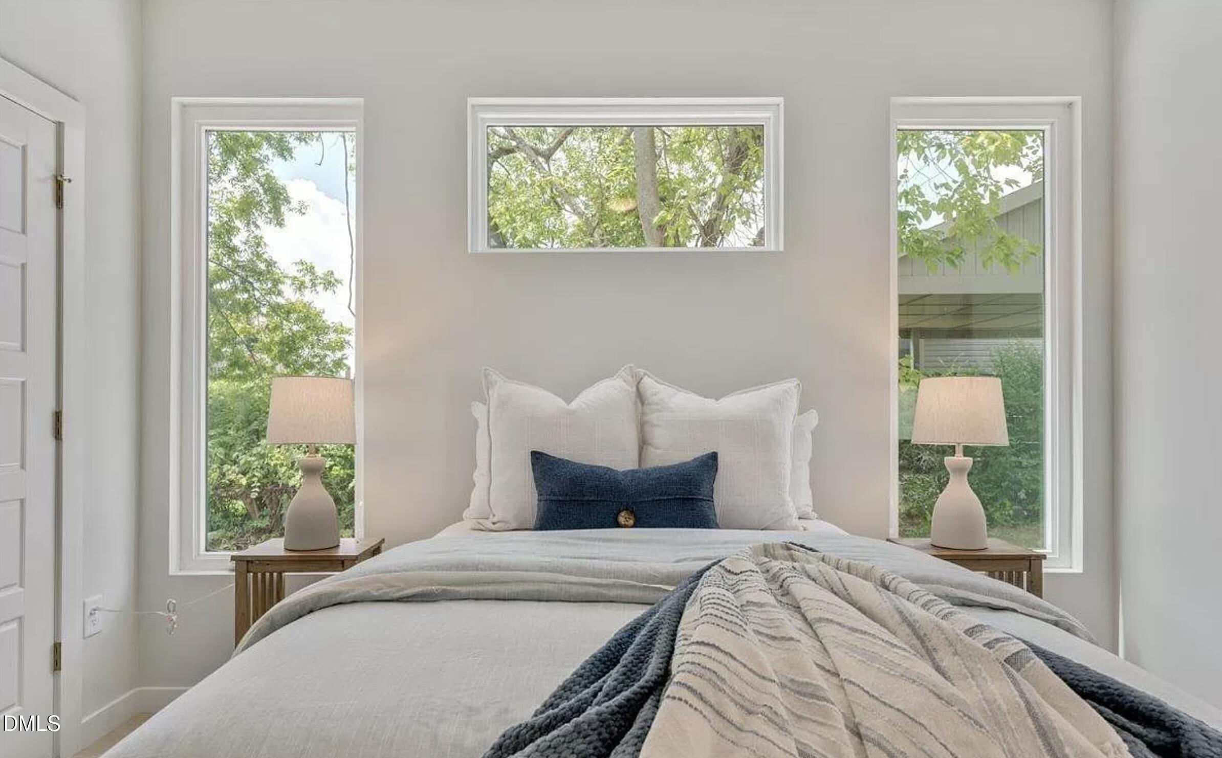 502 A Commonwealth Street Durham, NC 27703 - Photo 17 of 30 a bedroom with bed and window