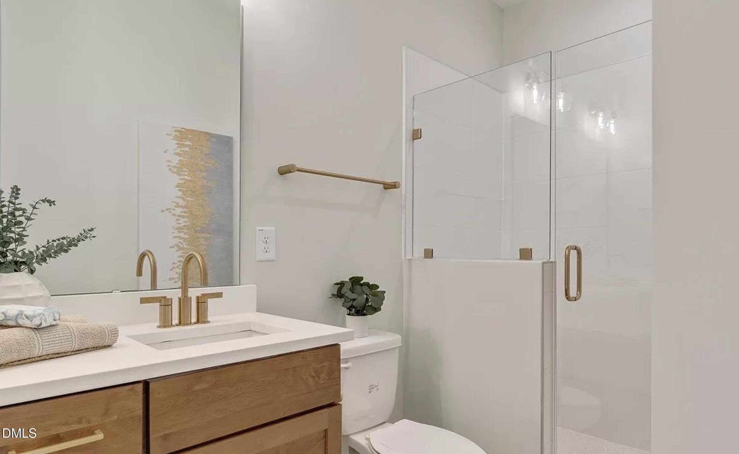 502 A Commonwealth Street Durham, NC 27703 - Photo 20 of 30 a bathroom with a sink vanity granite toilet and shower