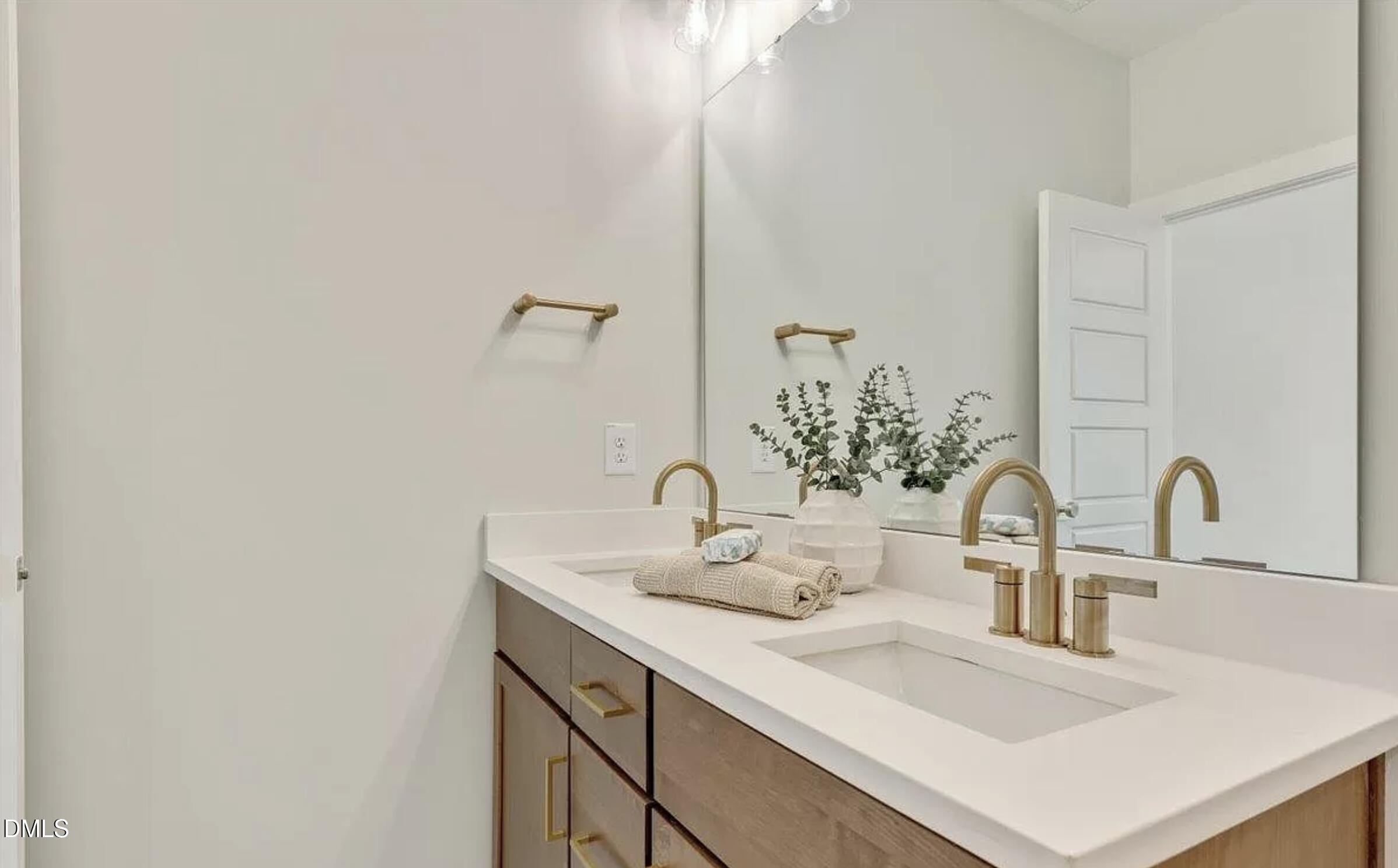 502 A Commonwealth Street Durham, NC 27703 - Photo 22 of 30 a bathroom with a sink and a mirror