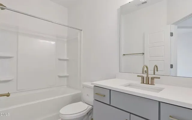 a bathroom with a sink toilet and a bathtub