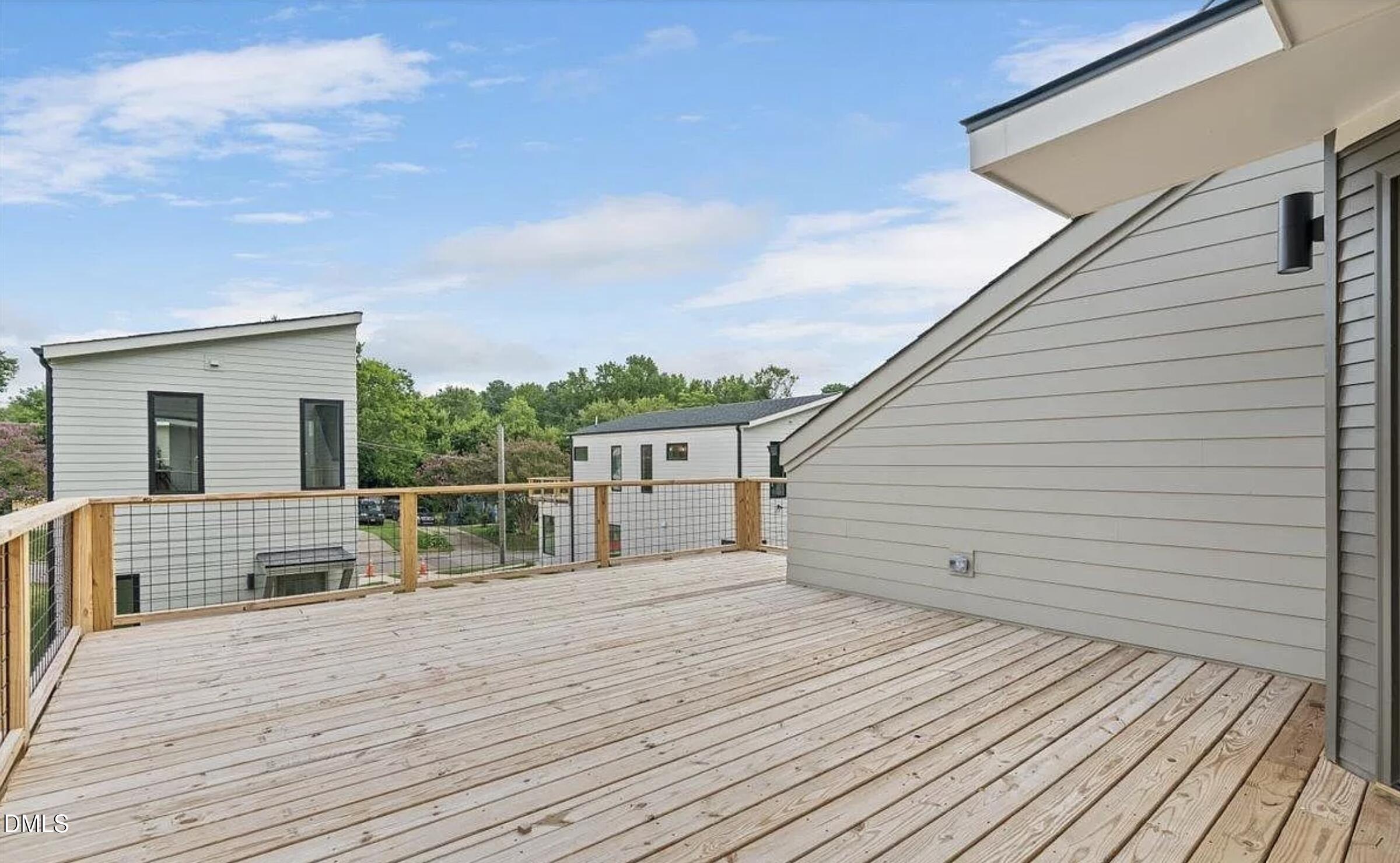 502 A Commonwealth Street Durham, NC 27703 - Photo 26 of 30 a view of house with deck and wooden floor