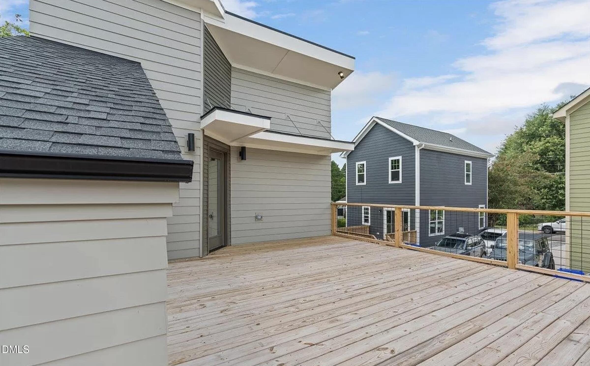 502 A Commonwealth Street Durham, NC 27703 - Photo 28 of 30 a view of a house with a wooden deck
