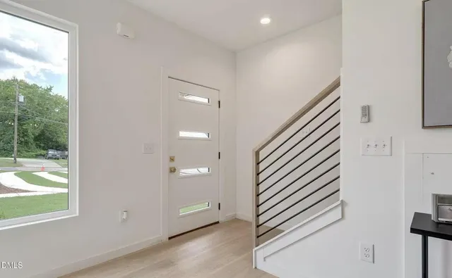 an entryway in a hall with a window