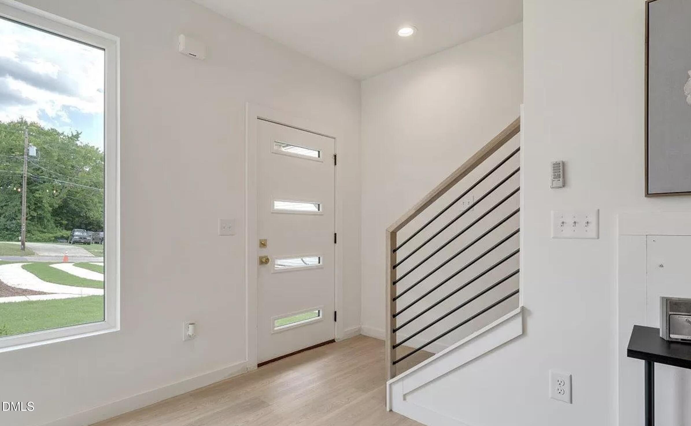502 A Commonwealth Street Durham, NC 27703 - Photo 3 of 30 an entryway in a hall with a window