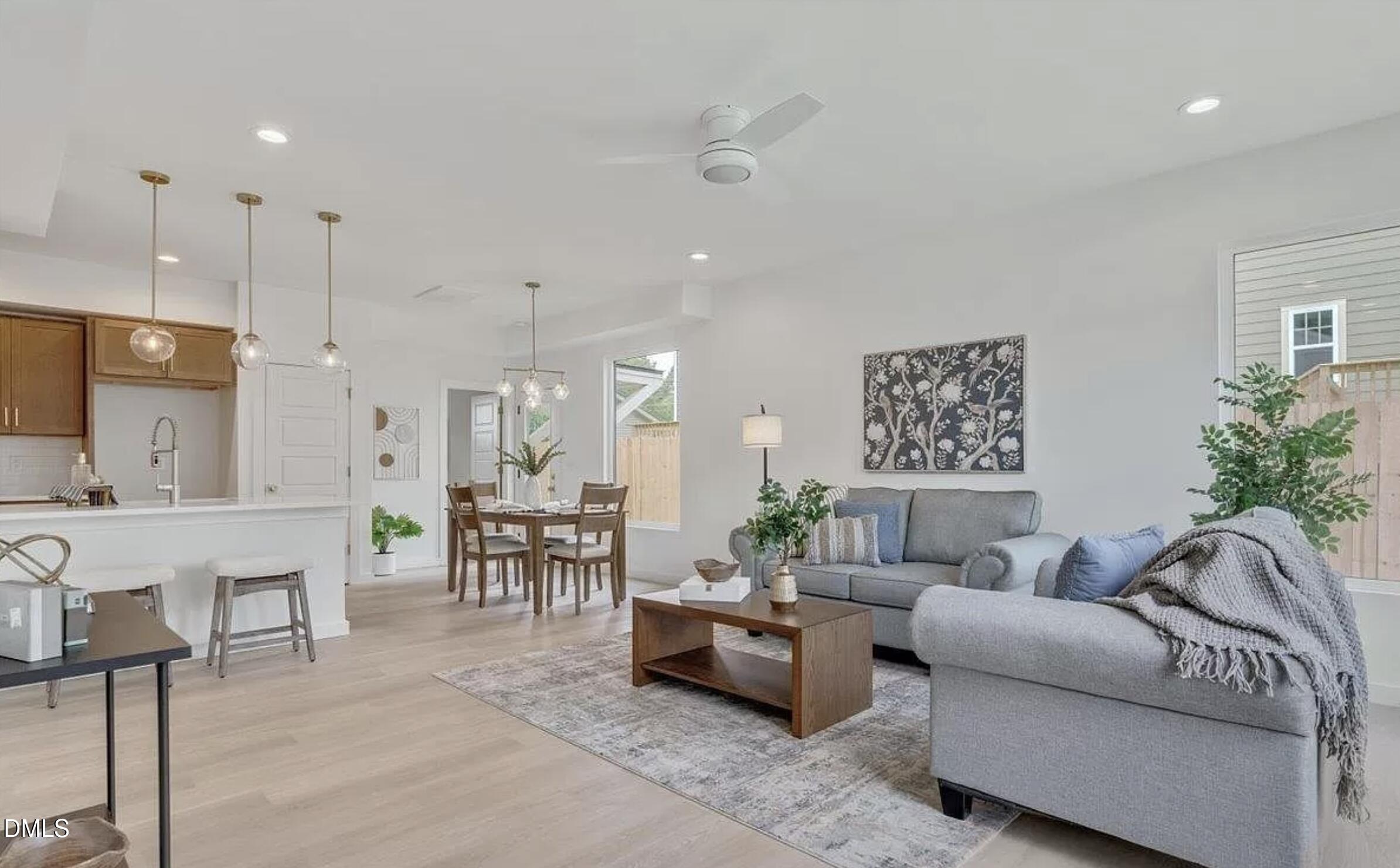 502 A Commonwealth Street Durham, NC 27703 - Photo 4 of 30 a living room with furniture and a large window
