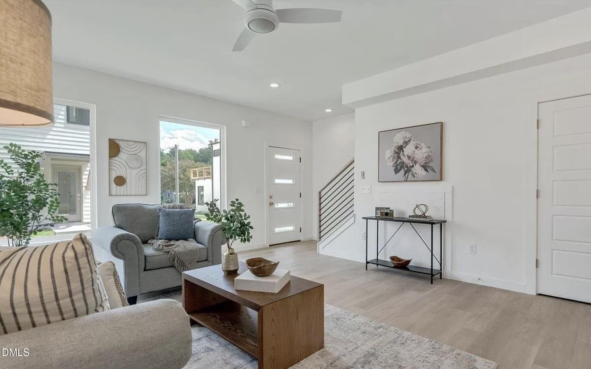 502 A Commonwealth Street Durham, NC 27703 - Photo 7 of 30 a living room with furniture and a potted plant