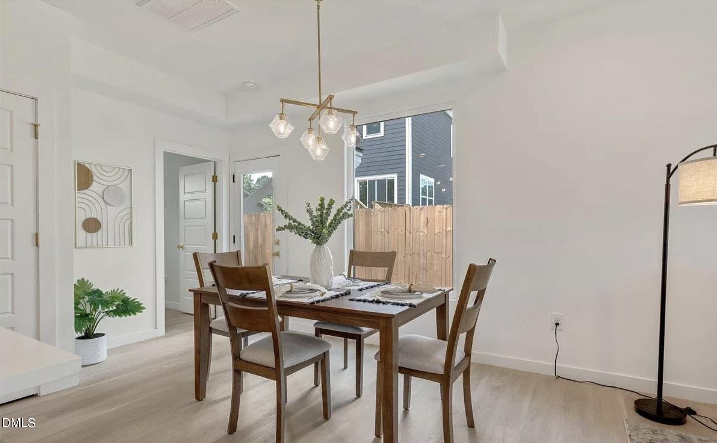 502 A Commonwealth Street Durham, NC 27703 - Photo 8 of 30 a view of a dining room with furniture and wooden floor