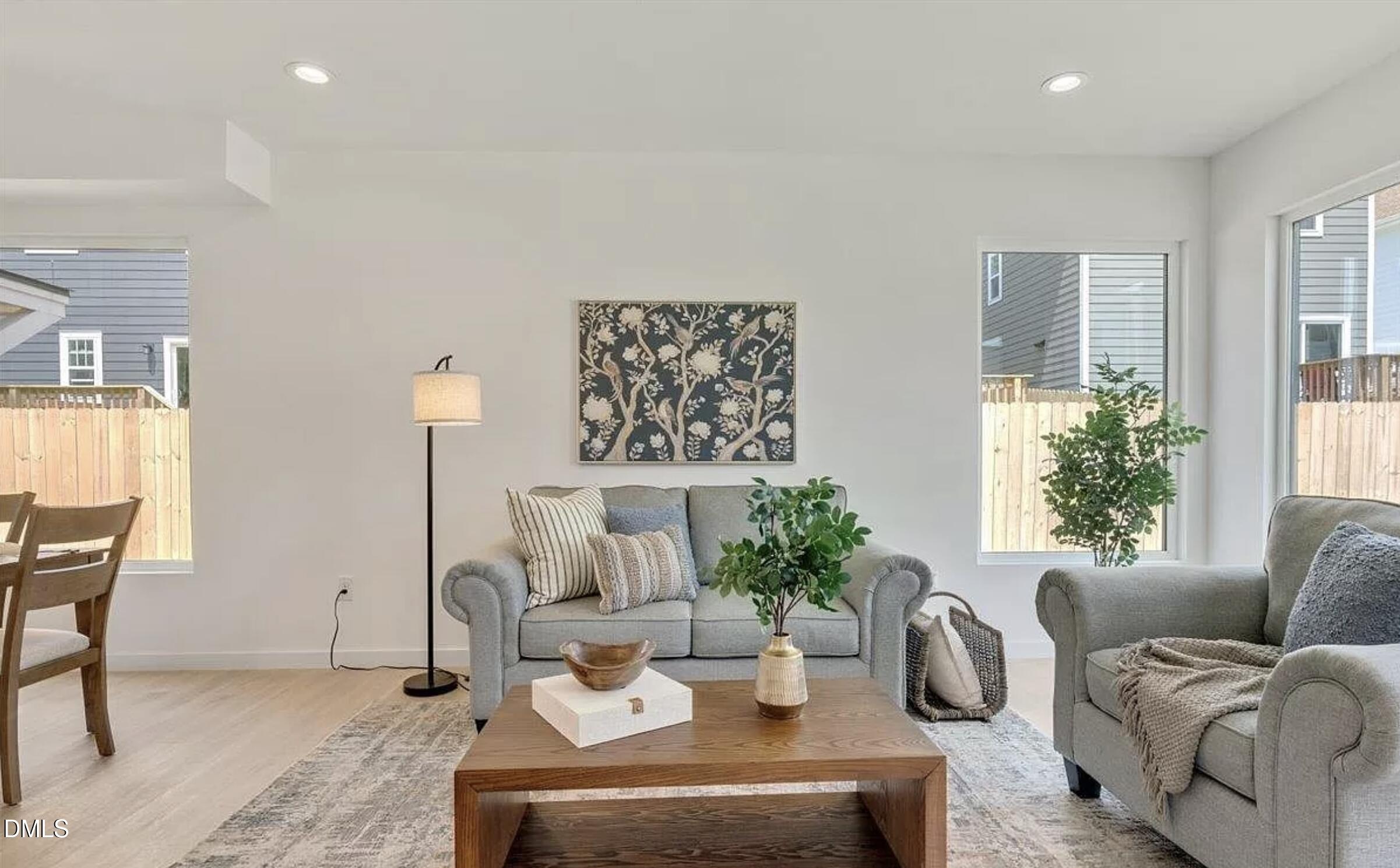502 A Commonwealth Street Durham, NC 27703 - Photo 9 of 30 a living room with furniture and a potted plant
