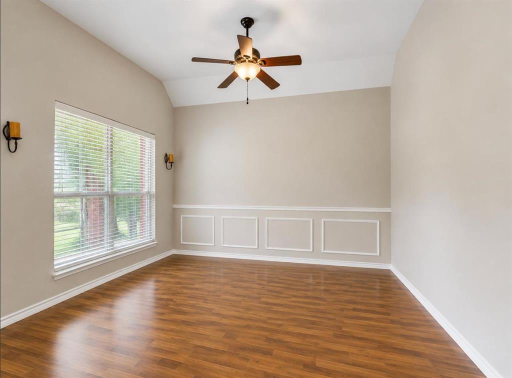 9962 Bell Rock Road Frisco, TX 75035 - Photo 4 of 28 a view of an empty room with a window and wooden floor