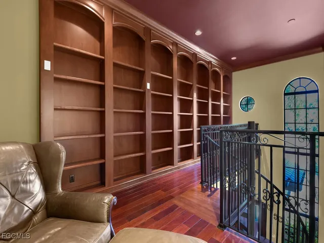 a view of a livingroom with furniture and staircase