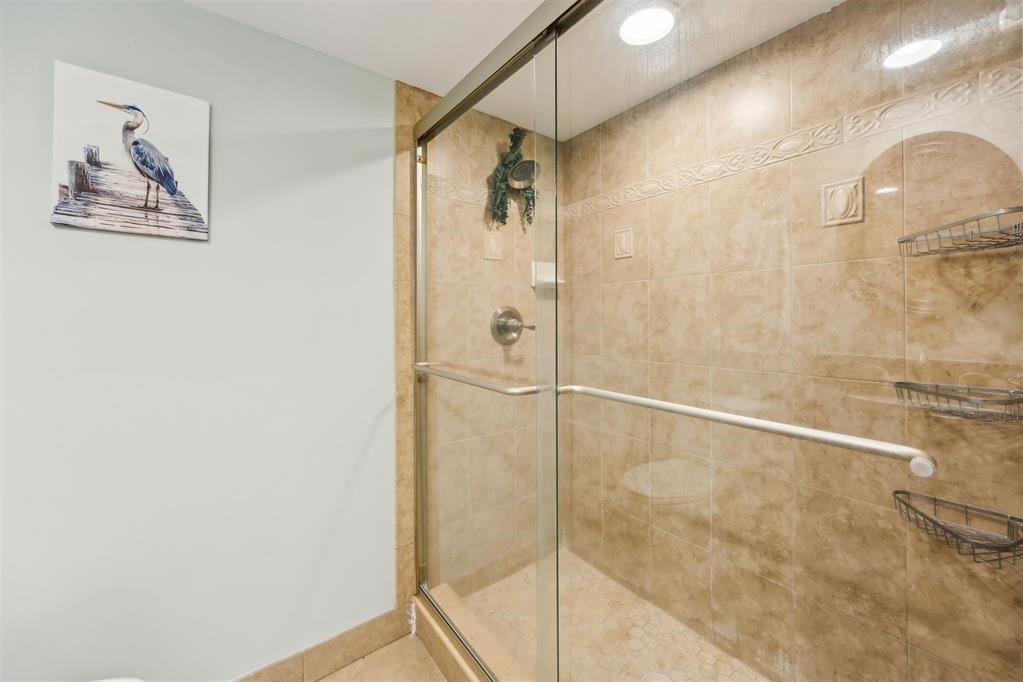 3033 Sea Marsh Road Fernandina Beach, FL 32034 - Photo 29 of 37 a bathroom with a shower