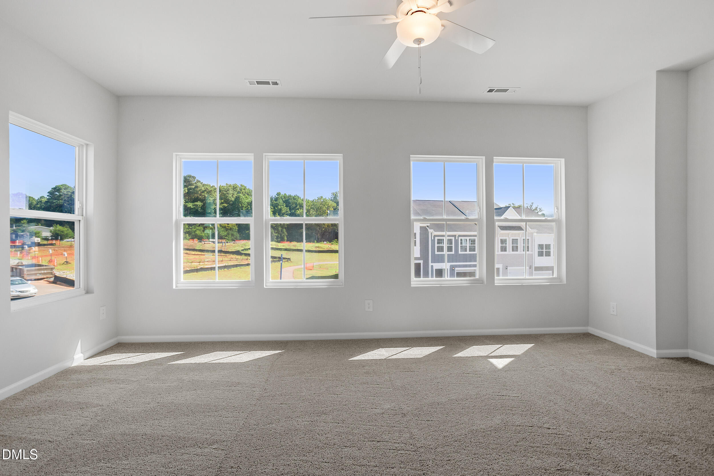 191 Powell Townes Way, Unit 319 Raleigh, NC 27603 - Photo 20 of 50 an empty room with windows