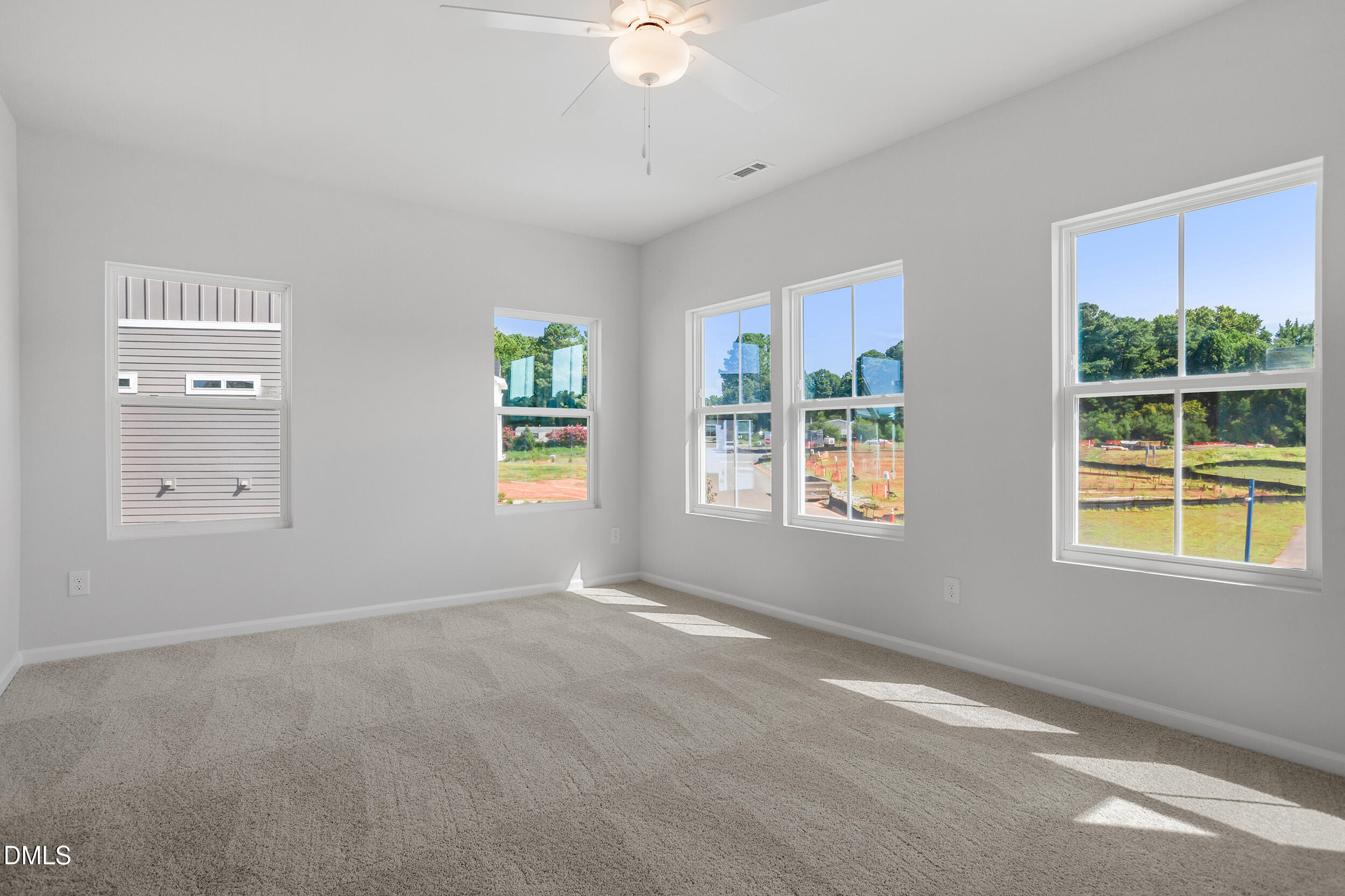 191 Powell Townes Way, Unit 319 Raleigh, NC 27603 - Photo 21 of 50 a view of an empty room with a window