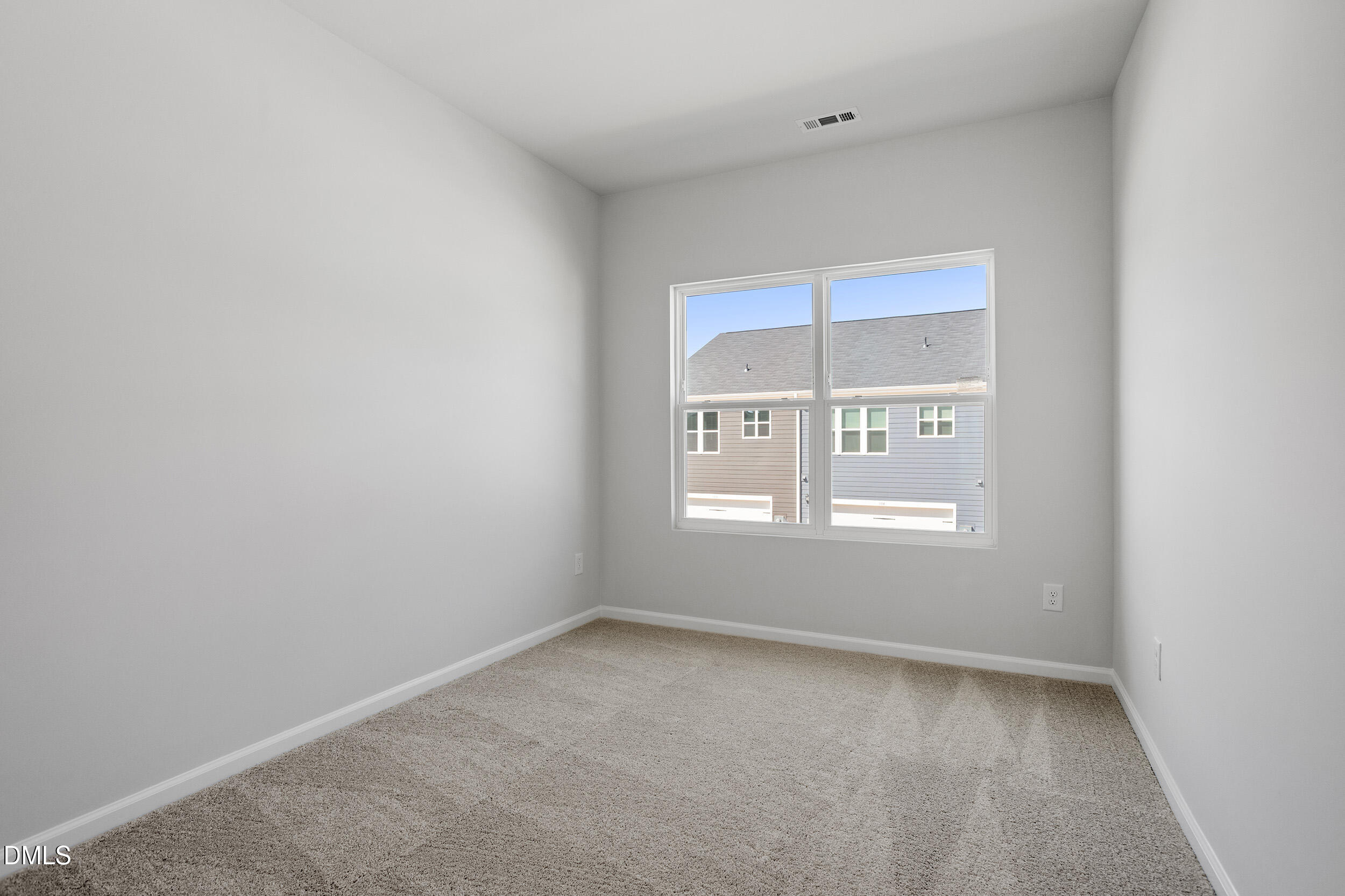 191 Powell Townes Way, Unit 319 Raleigh, NC 27603 - Photo 25 of 50 an empty room with a window
