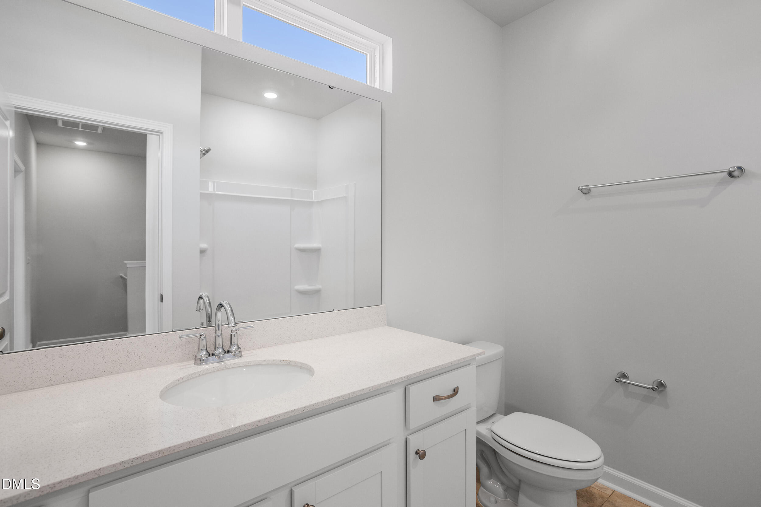 191 Powell Townes Way, Unit 319 Raleigh, NC 27603 - Photo 27 of 50 a bathroom with a sink toilet vanity and tub