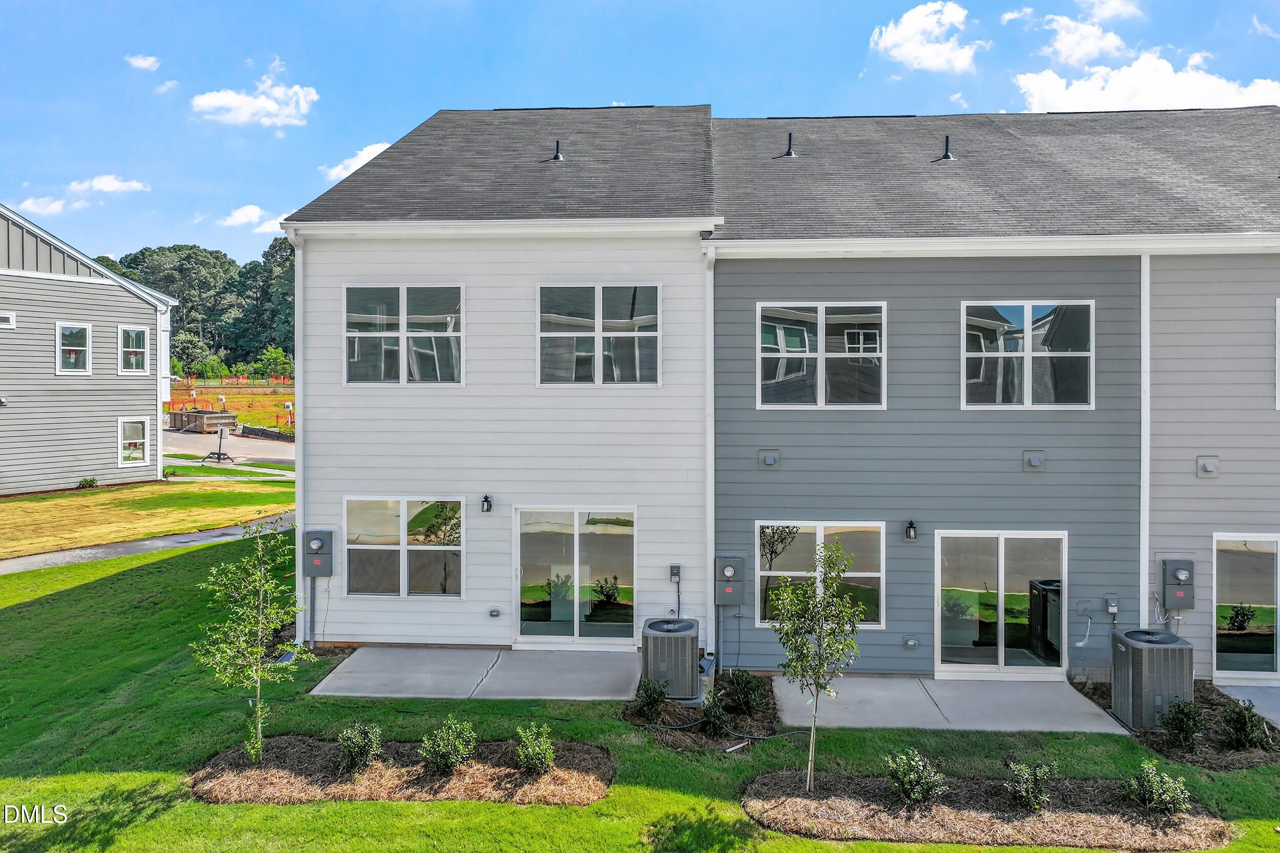 191 Powell Townes Way, Unit 319 Raleigh, NC 27603 - Photo 29 of 50 a front view of a house with garden
