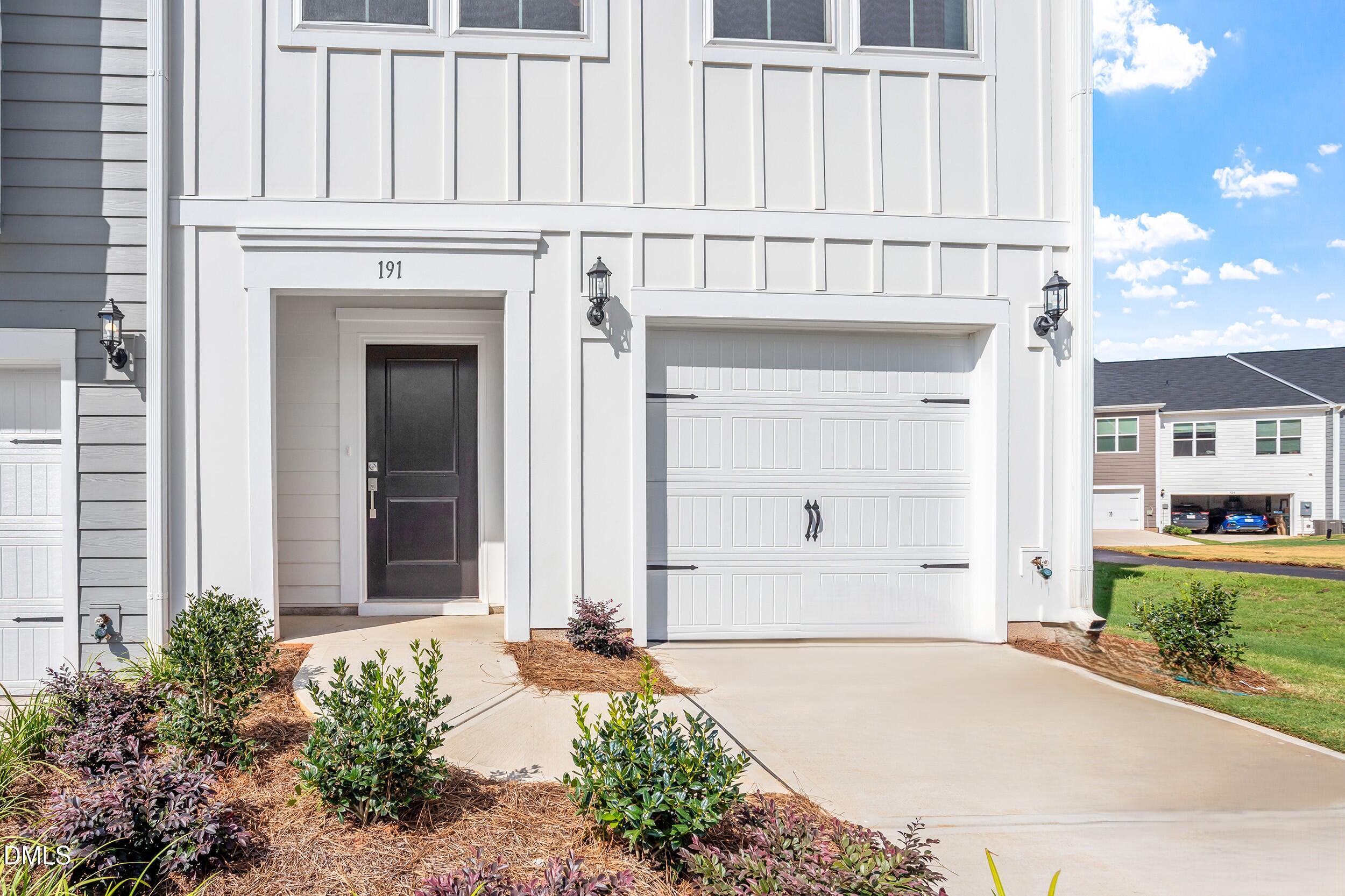 191 Powell Townes Way, Unit 319 Raleigh, NC 27603 - Photo 3 of 50 front view of a house with white walls