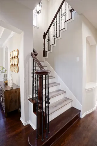 a view of entryway and hall with wooden floor
