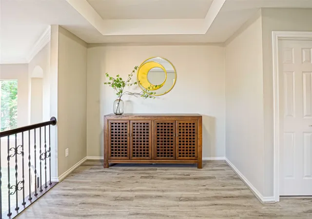 a view of a hallway with wooden floor