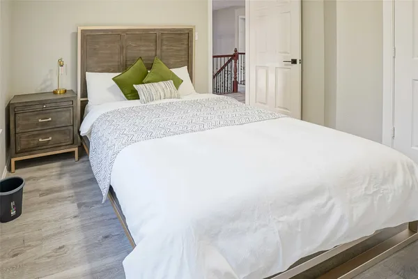 a bedroom with a bed and a closet