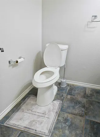 a bathroom with a toilet and a sink