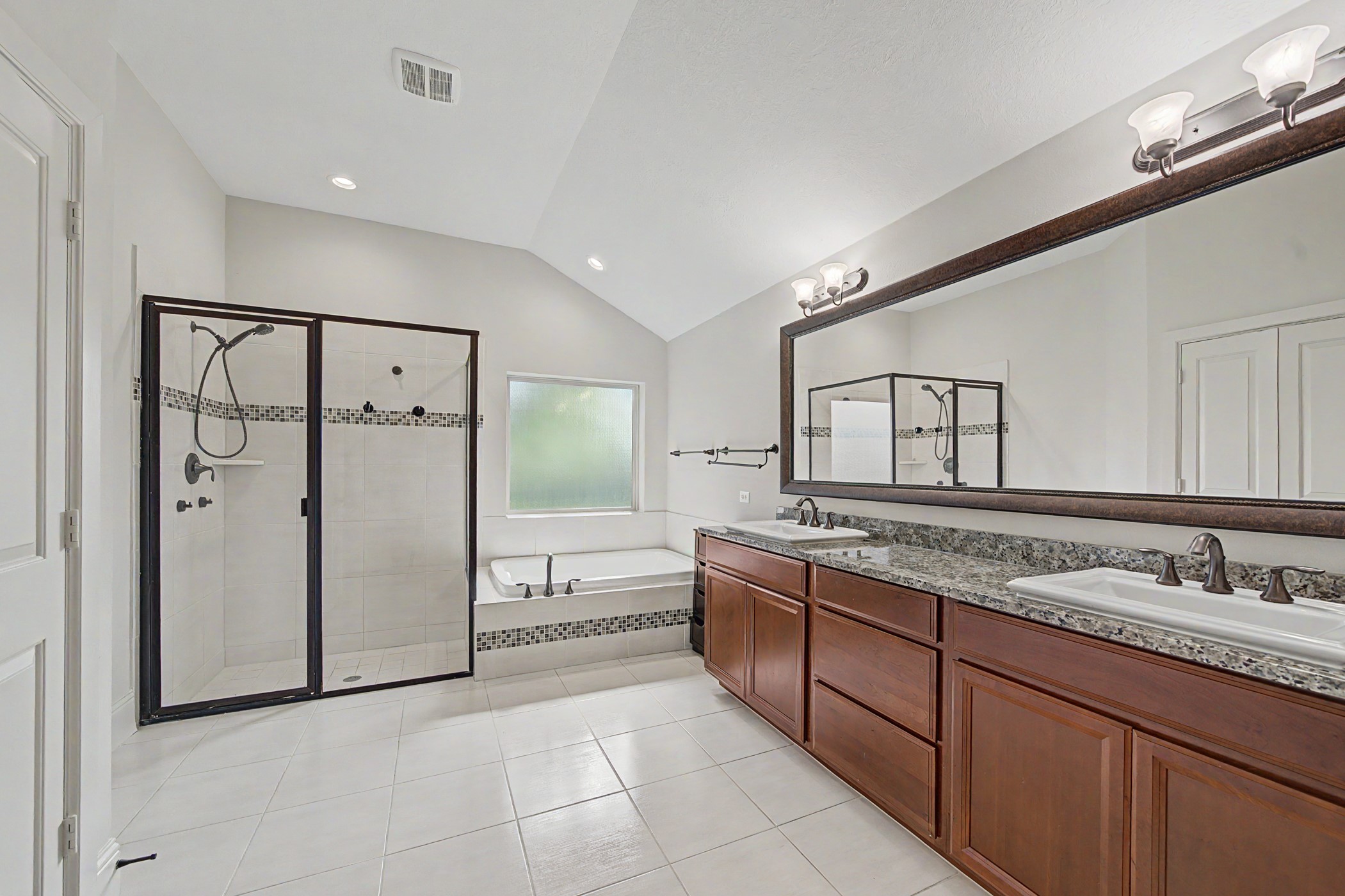 31032 Sunfall Trail Lane Spring, TX 77386 - Photo 18 of 39 a spacious bathroom with a granite countertop sink mirror and bathtub