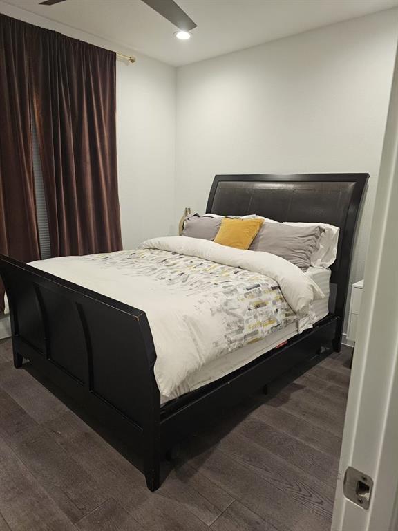 6004 Hudson Street, Unit 104 Dallas, TX 75206 - Photo 11 of 16 a bedroom with a bed and a window