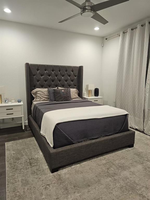 6004 Hudson Street, Unit 104 Dallas, TX 75206 - Photo 15 of 16 a bedroom with a bed and ceiling fan