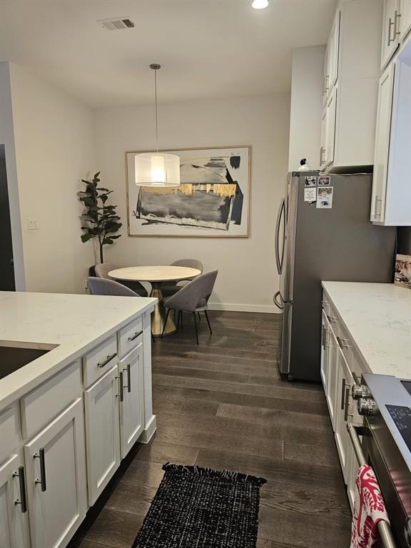 6004 Hudson Street, Unit 104 Dallas, TX 75206 - Photo 6 of 16 a kitchen with a sink appliances and cabinets