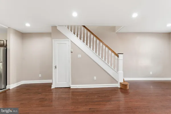 a view of an entryway with wooden floor