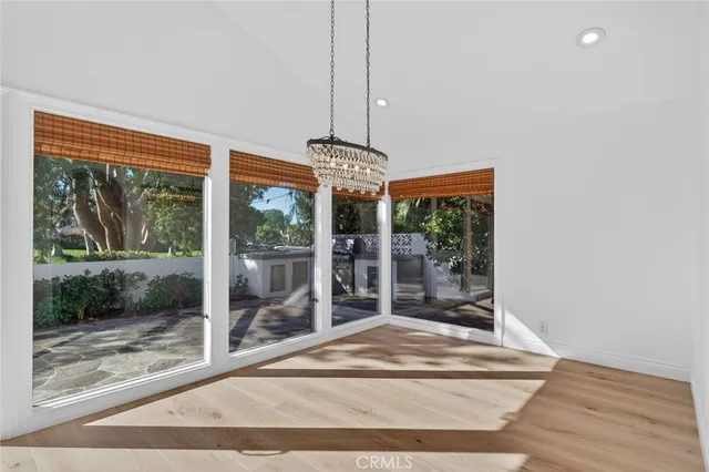 a kitchen with stainless steel appliances white cabinets a stove a sink and a refrigerator