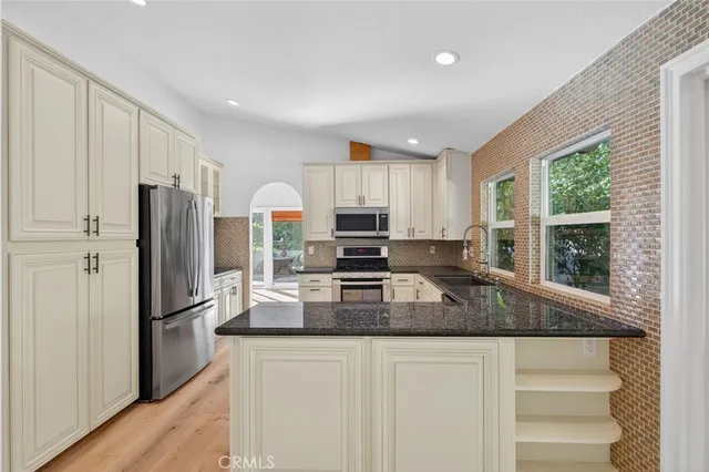 a view of a dinning room with furniture and wooden floor