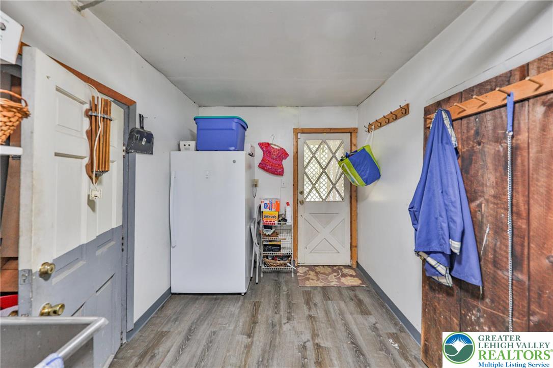 331 Cranberry Creek Road Cresco, PA 18326 - Photo 35 of 95 Functional mudroom with wood-look flooring and rustic accents, ready for daily use.