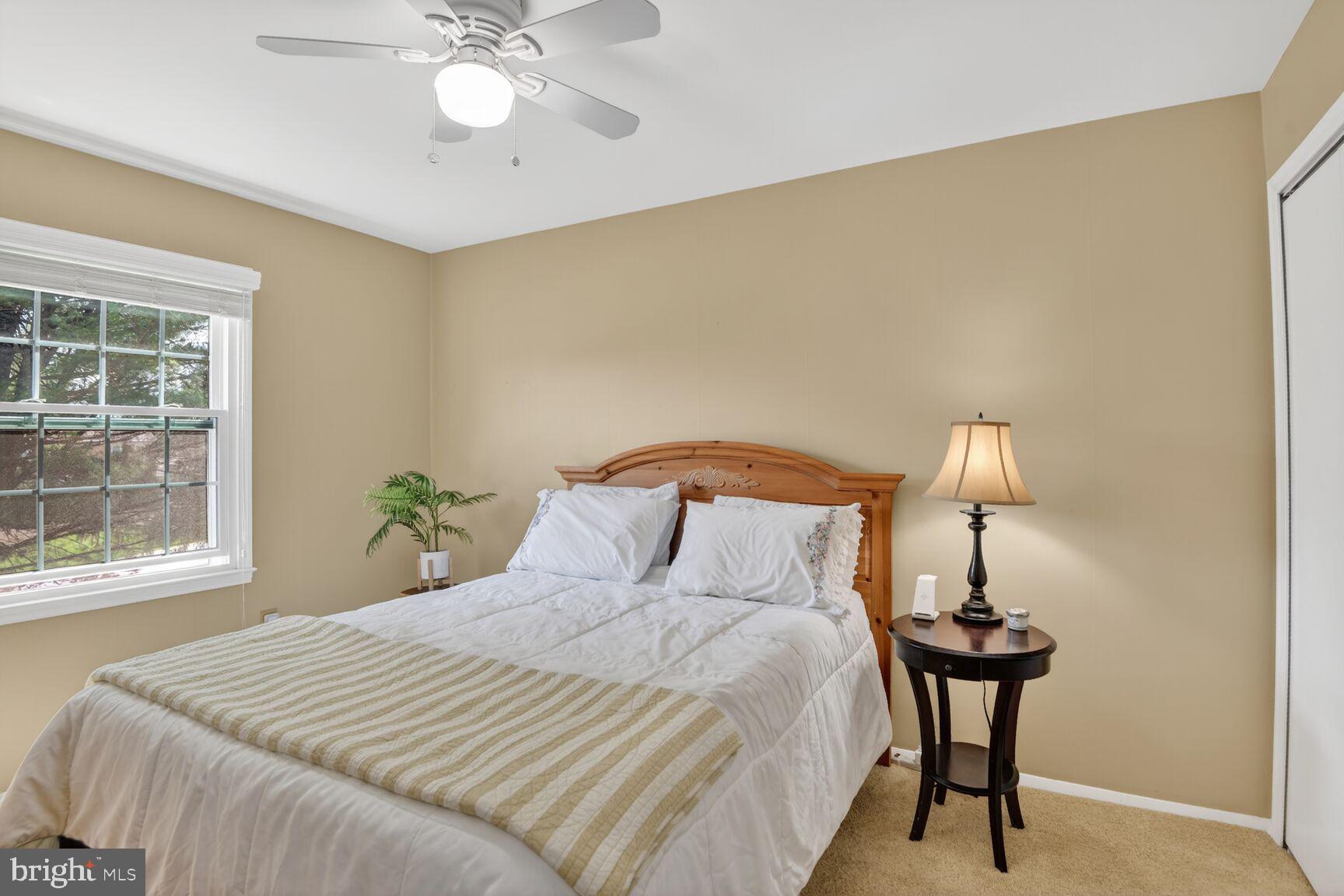 5382 View Point Court Sykesville, MD 21784 - Photo 22 of 32 a bedroom with a bed and a chandelier