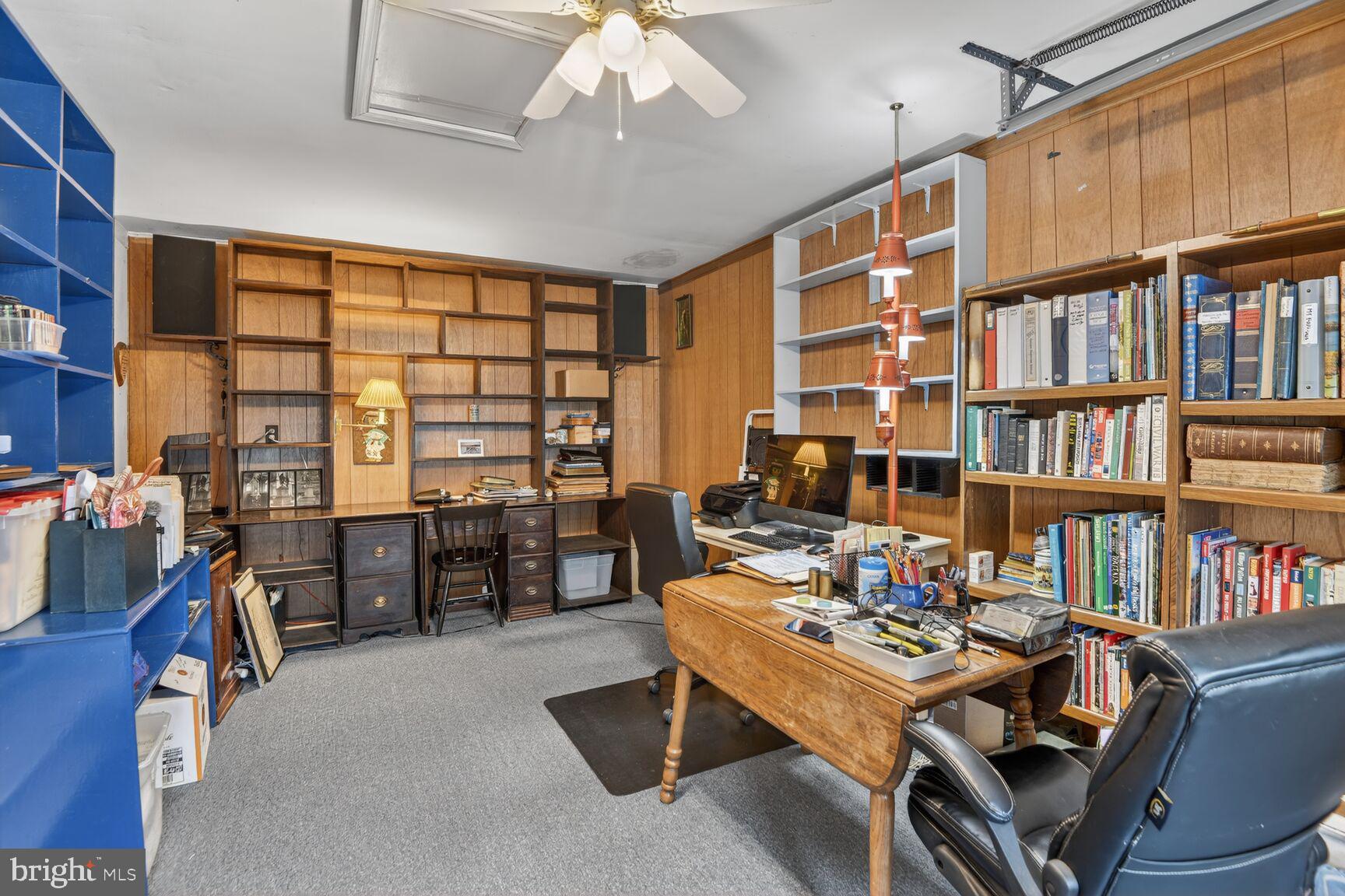 5382 View Point Court Sykesville, MD 21784 - Photo 26 of 32 a view of a workspace with furniture and a bookshelf