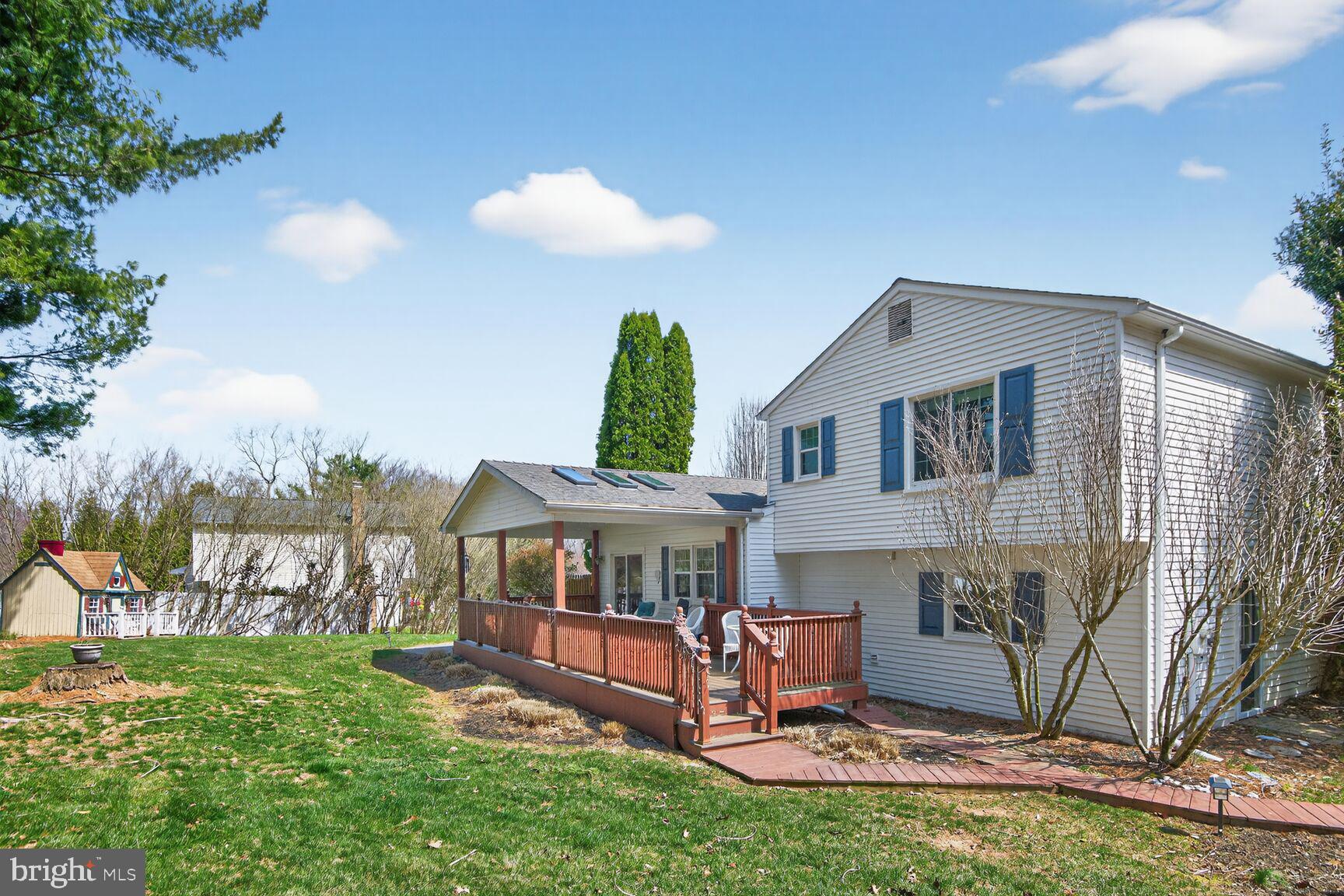 5382 View Point Court Sykesville, MD 21784 - Photo 31 of 32 a front view of house with yard and outdoor seating