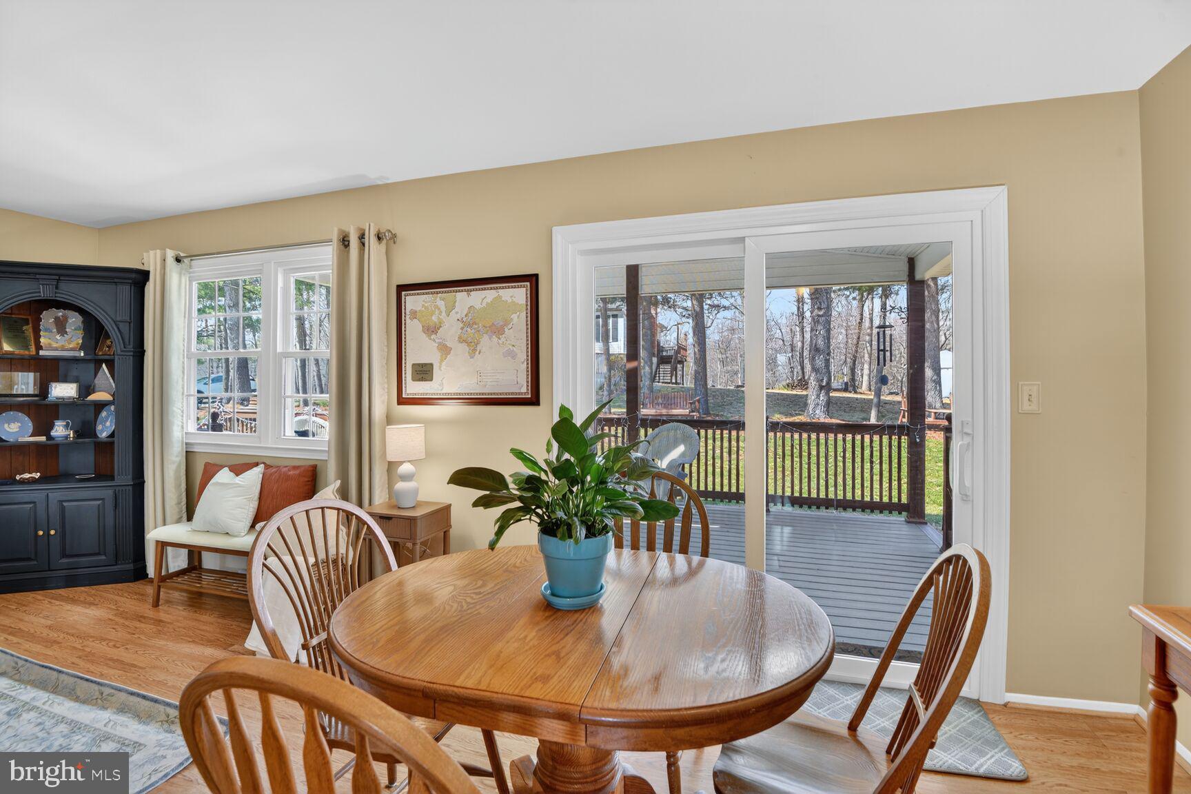 5382 View Point Court Sykesville, MD 21784 - Photo 7 of 32 a dining room with furniture a livingroom view and wooden floor