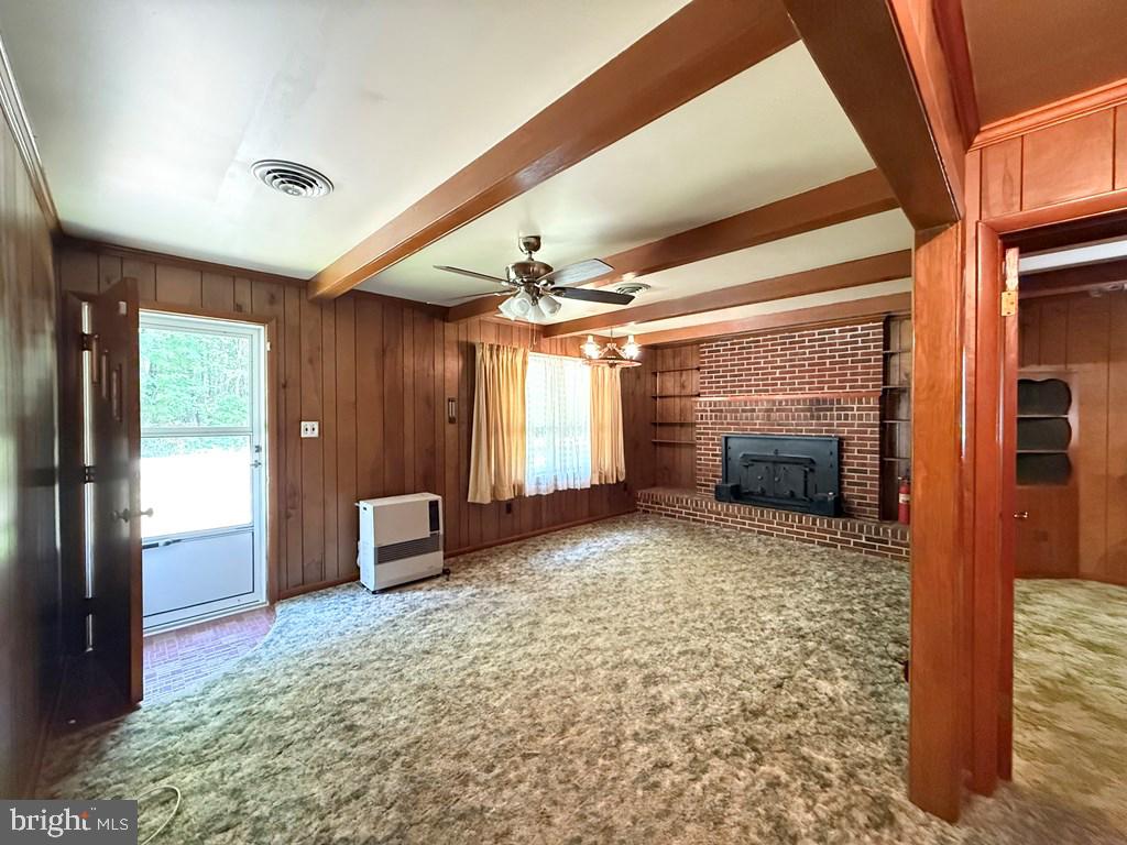 664 Sandy Point Road Heathsville, VA 22473 - Photo 10 of 12 Cozy living space with rustic charm.