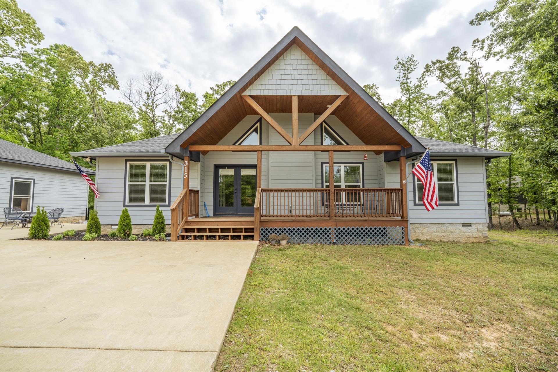 315 Timber Ridge Drive Counce, TN 38326 - Photo 2 of 40 a front view of a house with a porch and a yard