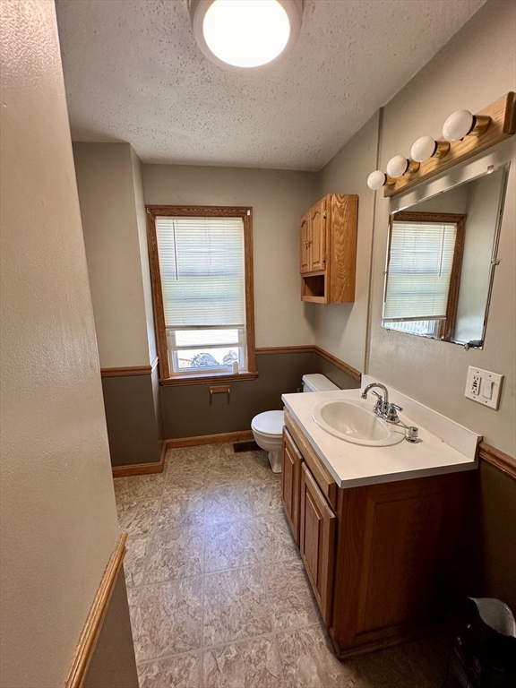 32 High Street Erving, MA 01344 - Photo 7 of 11 a bathroom with a sink and a mirror