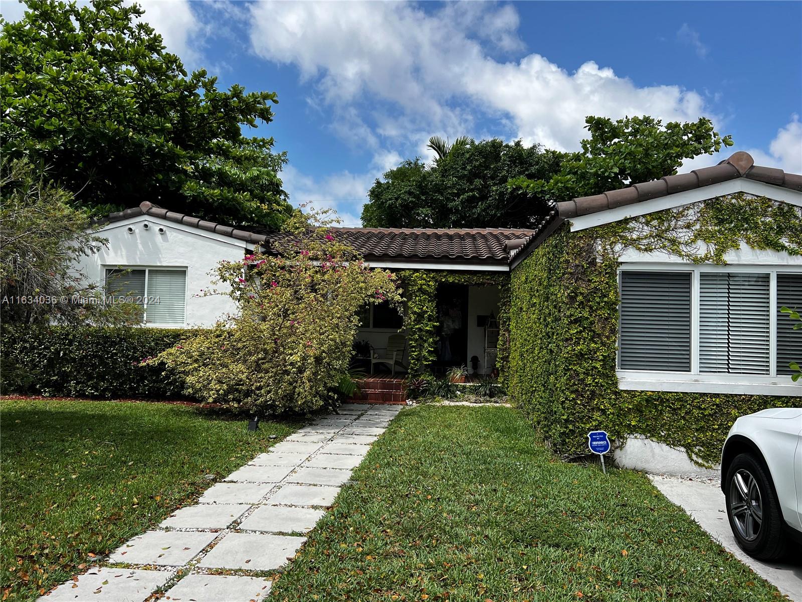 454 Southwest 25th Road Miami, FL 33129 - Photo 1 of 33 a view of a house with a backyard
