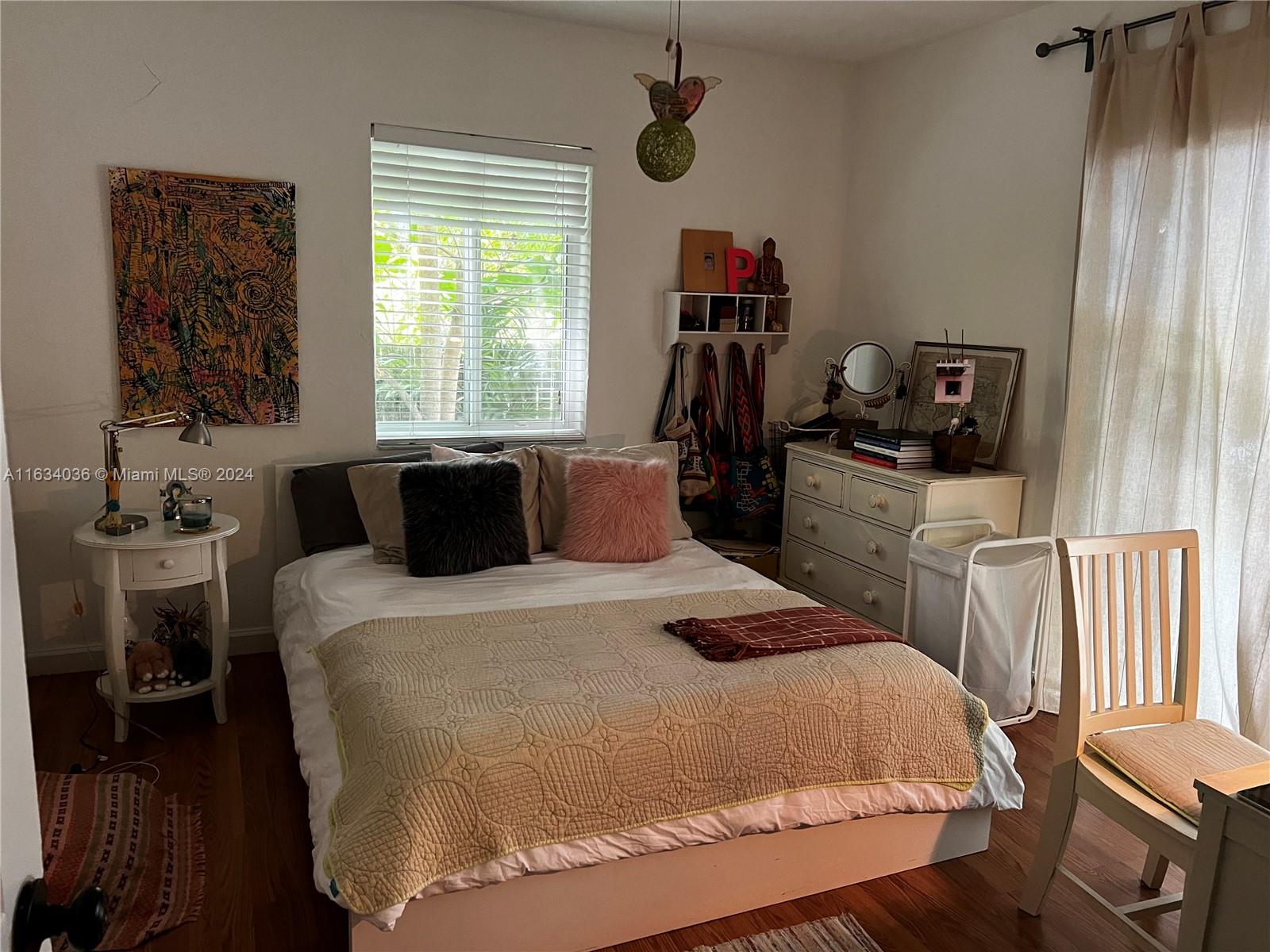 454 Southwest 25th Road Miami, FL 33129 - Photo 18 of 33 a bedroom with a bed and wooden floor