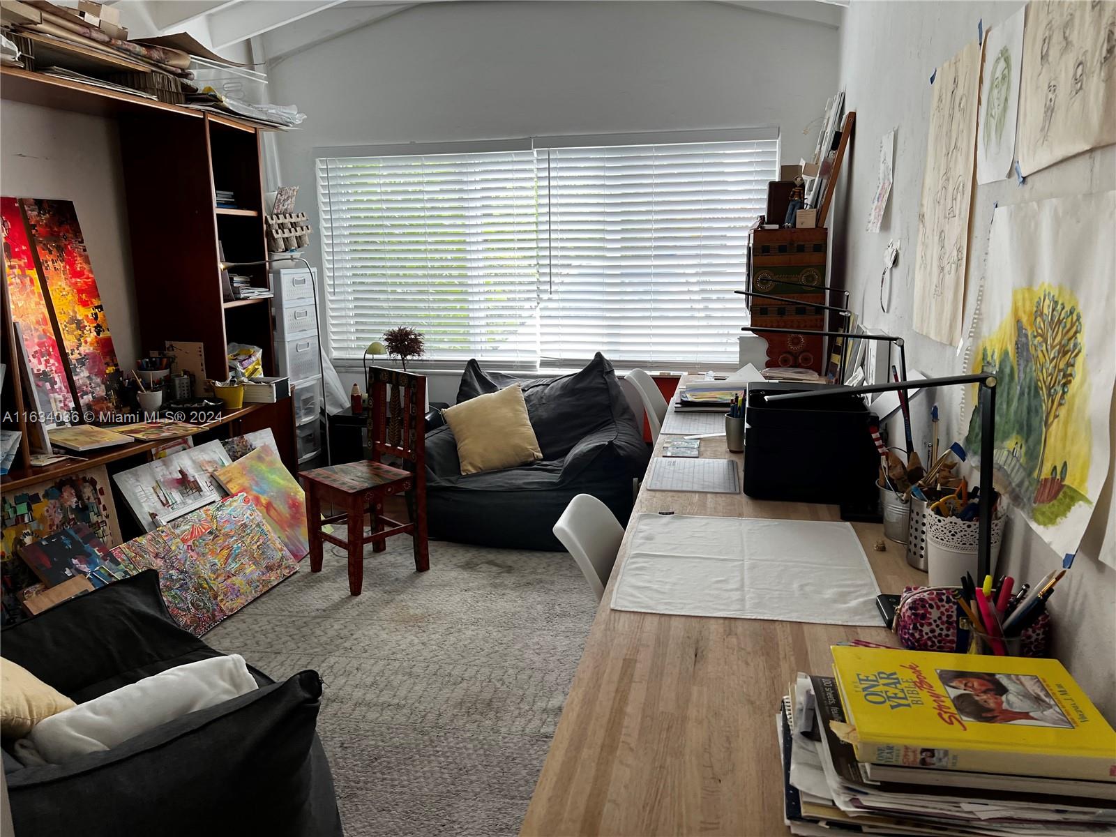 454 Southwest 25th Road Miami, FL 33129 - Photo 21 of 33 a living room with furniture and a flat screen tv