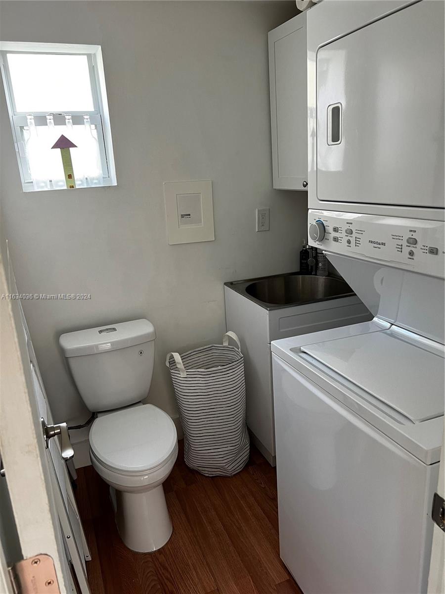 454 Southwest 25th Road Miami, FL 33129 - Photo 22 of 33 a white toilet sitting next to a bathroom sink