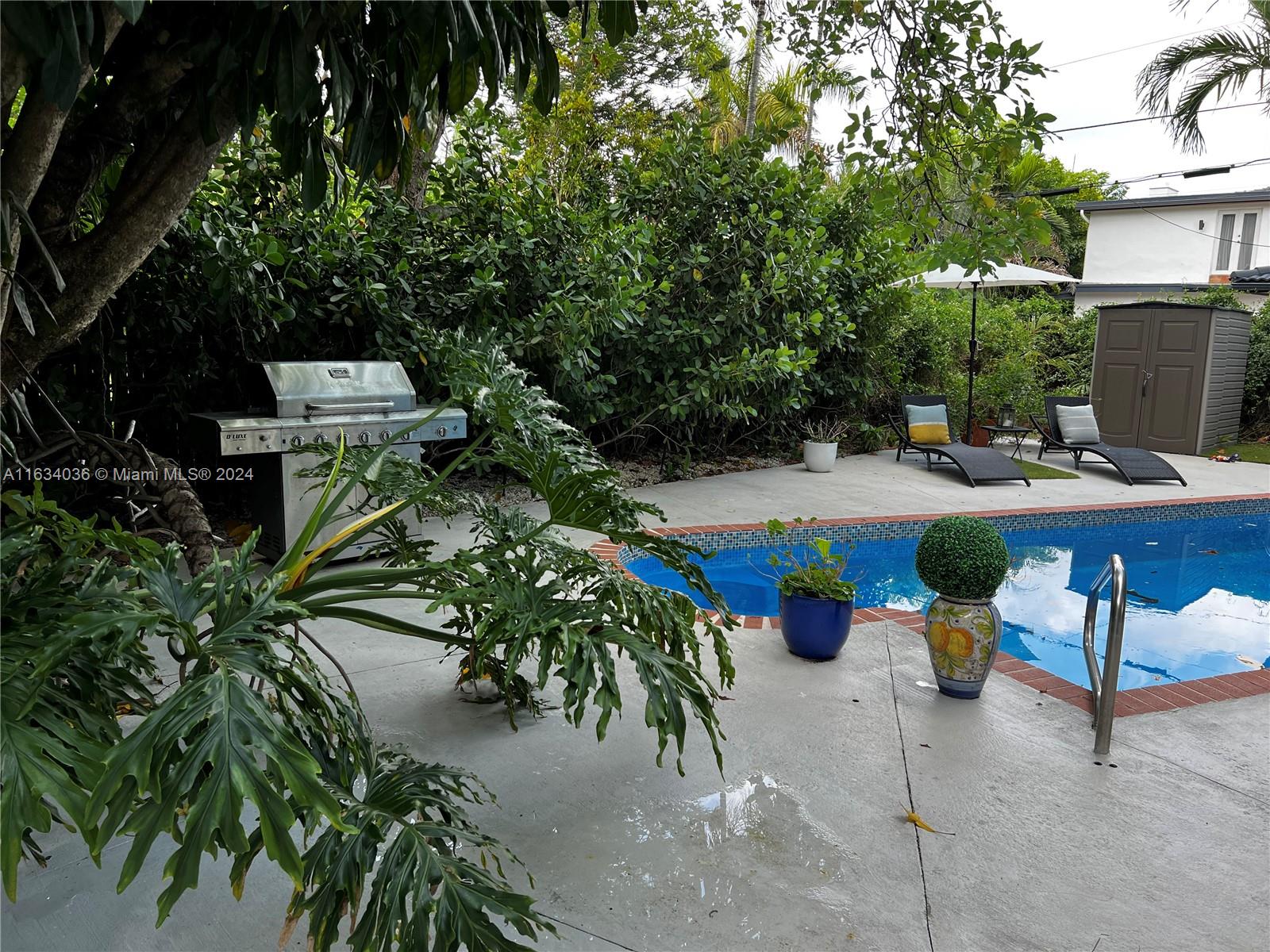 454 Southwest 25th Road Miami, FL 33129 - Photo 24 of 33 a view of a backyard with sitting area