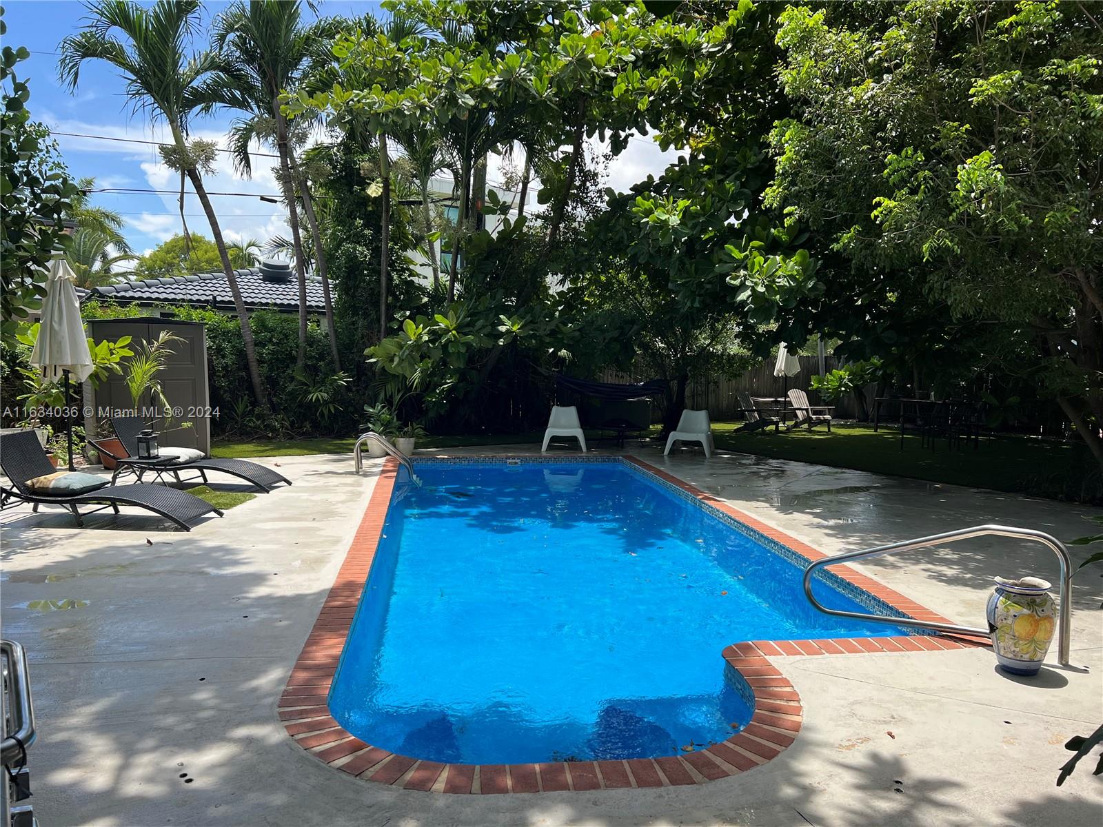 454 Southwest 25th Road Miami, FL 33129 - Photo 30 of 33 a view of a swimming pool with a patio